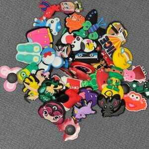 NIB Assorted Shoe Charms - set of 45